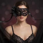 freepik__-prompt-a-woman-wearing-a-red-lace-masquerade-mask__93910
