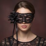 freepik__-prompt-a-woman-wearing-a-red-lace-masquerade-mask__93910.jpeg